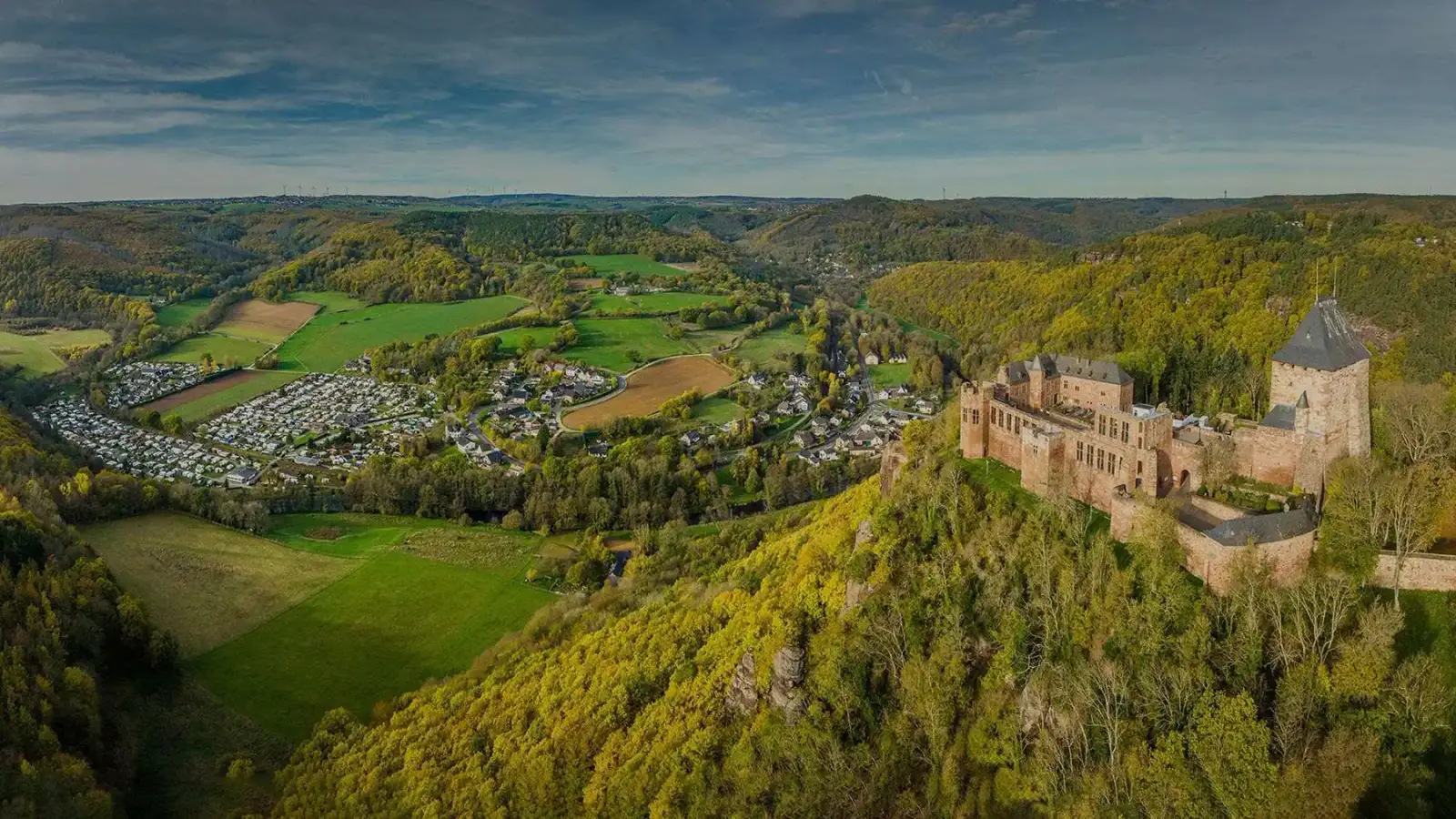 View over the Rur valley to Nideggen Castle with Campingplatz Hetzingen